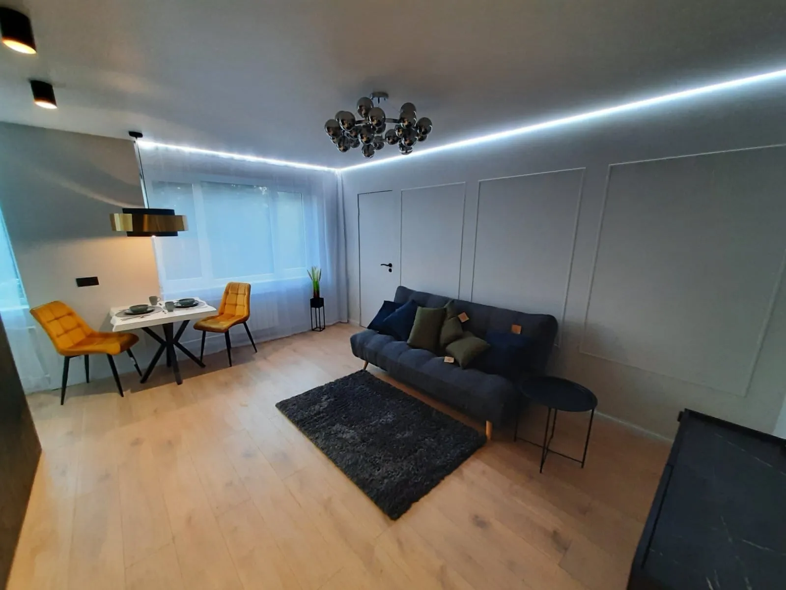 A living room with a couch and a table